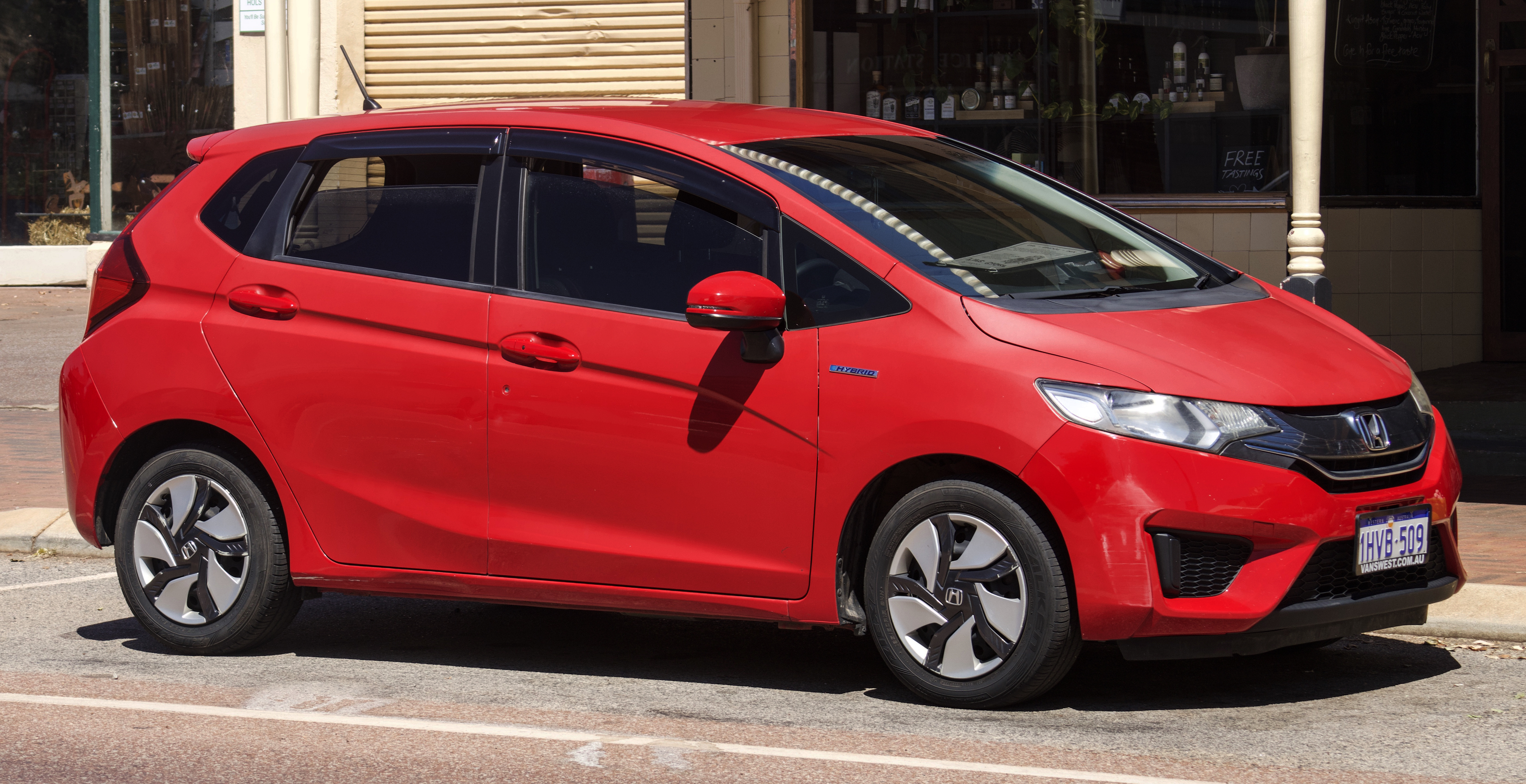 Representative red Honda Fit featured on the Grant Premium Rental website